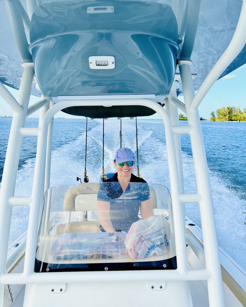 Woman driving the boat.